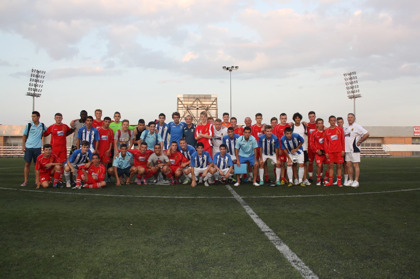Youth soccer players competing in a development match against local opposition