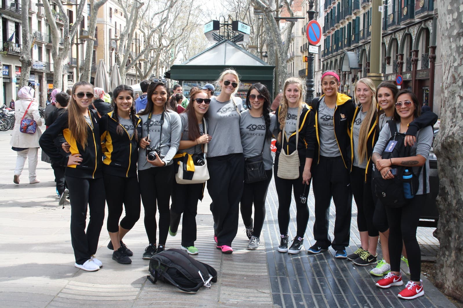 Youth soccer players exploring Las Ramblas in Barcelona during a club tour